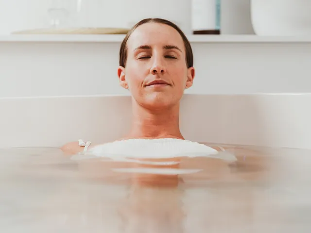 Woman relaxing in a bath during a body treatment at Davaar House