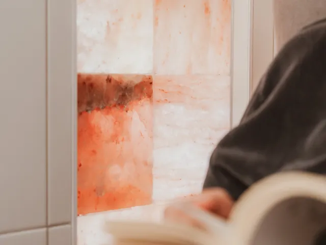 Himalayan salt wall glowing in the salt therapy room at Davaar House